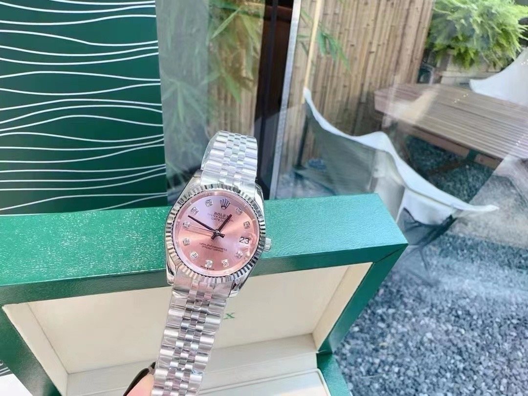 Rolex Pink Dial Silver Bracelet Watch — front